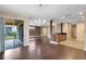 Spacious living area boasts hardwood floors, sliding glass doors to a patio, and an open floor plan at 1998 Michael Tiago Cir, Maitland, FL 32751