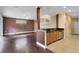 Open-concept living space featuring hardwood floors, a kitchen with granite counters, and neutral color palette at 1998 Michael Tiago Cir, Maitland, FL 32751