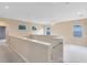 Spacious upstairs loft featuring neutral walls, and multiple windows for natural light at 1998 Michael Tiago Cir, Maitland, FL 32751