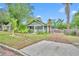 Bungalow-style home featuring a screened porch, driveway, and established landscaping at 2011 Harmon Ave, Winter Park, FL 32789
