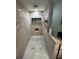 Bathroom featuring an elegant walk-in shower with modern fixtures and design at 2154 Lake Christie Dr, Orlando, FL 32809
