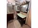 Bathroom with a modern vanity, large mirror, shower with glass door, and light-colored tile at 2154 Lake Christie Dr, Orlando, FL 32809