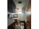 Cozy bathroom featuring a stand-up shower, wood paneling, and updated fixtures at 2154 Lake Christie Dr, Orlando, FL 32809