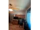 Bedroom with a ceiling fan, a window with curtains, and a desk setup at 2154 Lake Christie Dr, Orlando, FL 32809