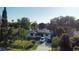 Inviting single story home featuring solar panels, mature trees, and a well manicured lawn in a lakefront community at 2154 Lake Christie Dr, Orlando, FL 32809