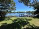 Scenic lake view with a private dock, offering a serene retreat and access to the water at 2154 Lake Christie Dr, Orlando, FL 32809