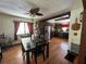 Open concept living room features a dining area, hardwood floors and lots of light at 2154 Lake Christie Dr, Orlando, FL 32809
