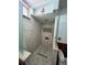 Spacious shower with elegant tilework, glass partition, and modern fixtures at 2154 Lake Christie Dr, Orlando, FL 32809