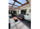 Bright sunroom with skylight, ceiling fan, comfortable seating, and outdoor access at 2154 Lake Christie Dr, Orlando, FL 32809