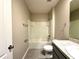 Bathroom featuring a tub and shower combination and a single sink vanity at 216 Grove Branch Rd, Winter Haven, FL 33880