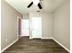Bedroom with dark wood flooring and white doors at 216 Grove Branch Rd, Winter Haven, FL 33880