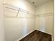 Walk-in closet with wooden floors and wire shelving at 216 Grove Branch Rd, Winter Haven, FL 33880