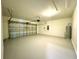 Garage featuring an open garage door and epoxy flooring at 216 Grove Branch Rd, Winter Haven, FL 33880