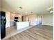Spacious open concept kitchen with ample counter space, flowing into a living area with wood-look floors at 216 Grove Branch Rd, Winter Haven, FL 33880