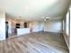 Open-concept layout featuring a kitchen with an island, flowing into a living area with stylish floors at 216 Grove Branch Rd, Winter Haven, FL 33880