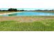 Scenic view of a serene pond, enhancing the community's appeal and natural beauty at 216 Grove Branch Rd, Winter Haven, FL 33880