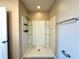 Bathroom shower featuring a white shower stall with chrome fixtures and neutral paint at 216 Grove Branch Rd, Winter Haven, FL 33880