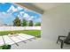 Covered back patio overlooking the backyard featuring a fire pit at 2731 Rowan St, Tavares, FL 32778