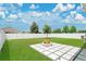 Backyard with green grass, patio and fire pit at 2731 Rowan St, Tavares, FL 32778