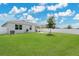 Backyard features a fire pit and spacious grassy area, perfect for outdoor activities at 2731 Rowan St, Tavares, FL 32778