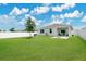 Spacious backyard features a fire pit and large lawn area at 2731 Rowan St, Tavares, FL 32778