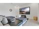 Living room with a flatscreen television, stylish modular sofa and wood accents at 2731 Rowan St, Tavares, FL 32778