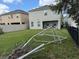 Back yard with green space and partial fencing at 2753 Monticello Way, Kissimmee, FL 34741