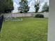 Well-maintained backyard with lush green grass, and a white privacy fence at 2753 Monticello Way, Kissimmee, FL 34741