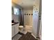 Cozy bathroom featuring a shower/tub combo, granite countertops, and stylish decorative tile at 2753 Monticello Way, Kissimmee, FL 34741