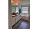 Bright bathroom features double vanity, a garden tub, and glass-enclosed shower for a spa-like experience at 2753 Monticello Way, Kissimmee, FL 34741