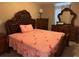 Traditional bedroom featuring a dark wood bedroom set and a decorative bedspread at 2753 Monticello Way, Kissimmee, FL 34741