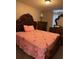 Bedroom featuring a cherry-themed bed, a hardwood frame, and traditional style furniture at 2753 Monticello Way, Kissimmee, FL 34741