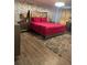 Bedroom features decorative wallpaper, wood-look floors, and a cozy shag rug at 2753 Monticello Way, Kissimmee, FL 34741