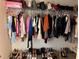 Well-organized closet featuring an array of shoes and fashionable clothing at 2753 Monticello Way, Kissimmee, FL 34741