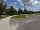 Community playground and walking path surrounded by mature trees at 2753 Monticello Way, Kissimmee, FL 34741