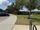 Exterior view of community buildings with lush landscaping surrounding sidewalks and parking area at 2753 Monticello Way, Kissimmee, FL 34741