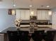 Kitchen with a large island, granite countertops, pendant lights, and stainless steel appliances at 2753 Monticello Way, Kissimmee, FL 34741