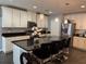 Kitchen featuring granite countertops, a large island, pendant lighting, and stainless steel appliances at 2753 Monticello Way, Kissimmee, FL 34741