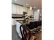 Kitchen boasts granite countertops, a large island, pendant lighting, and stainless steel appliances at 2753 Monticello Way, Kissimmee, FL 34741