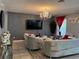 Bright living room showcasing a chandelier, tile floors, and comfortable seating at 2753 Monticello Way, Kissimmee, FL 34741
