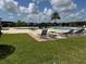 Community pool featuring numerous lounge chairs and a lovely sunbathing area at 2753 Monticello Way, Kissimmee, FL 34741