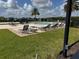 Community pool featuring numerous lounge chairs and a lovely sunbathing area at 2753 Monticello Way, Kissimmee, FL 34741
