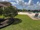 Community pool area with lounge chairs and a beautiful manicured lawn at 2753 Monticello Way, Kissimmee, FL 34741