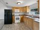 Efficient kitchen with light wood cabinets, modern appliances, and ample counter space at 2845 Ellis Ave, Lakeland, FL 33803