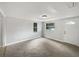 Bright living room with fresh paint, plush carpeting, and natural light at 2845 Ellis Ave, Lakeland, FL 33803