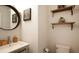 Clean bathroom features a sink, shelving and a toilet at 3254 Oak Lake Pl # 137, Winter Park, FL 32792