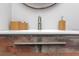 Close-up on a rustic bathroom sink with bamboo accessories at 3254 Oak Lake Pl # 137, Winter Park, FL 32792