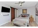 Inviting bedroom with modern sliding barn door, stylish décor, and a comfortable bed at 3254 Oak Lake Pl # 137, Winter Park, FL 32792