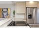 Modern kitchen featuring stainless steel refrigerator and flat top range at 3254 Oak Lake Pl # 137, Winter Park, FL 32792