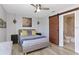 Stylized bedroom with a sliding barn door bathroom entrance at 3254 Oak Lake Pl # 137, Winter Park, FL 32792